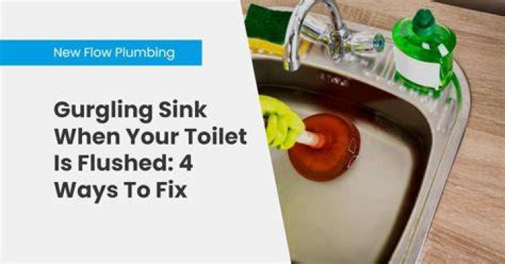 Why does my bathroom sink gurgle when I flush the toilet?