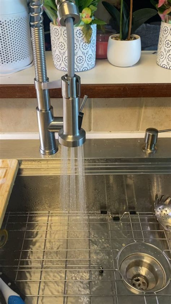 Why does my kitchen sink make noise when I turn it on?