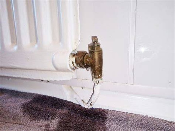 Why does my steam radiator spit out water?