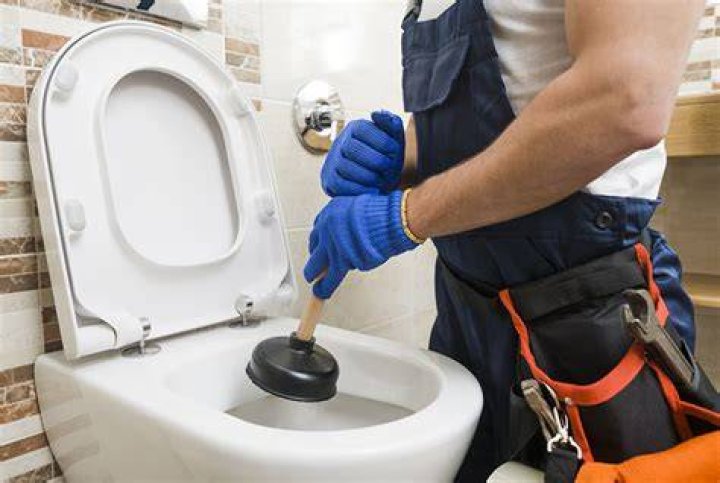 Why does my toilet not flush when I hold the handle down?