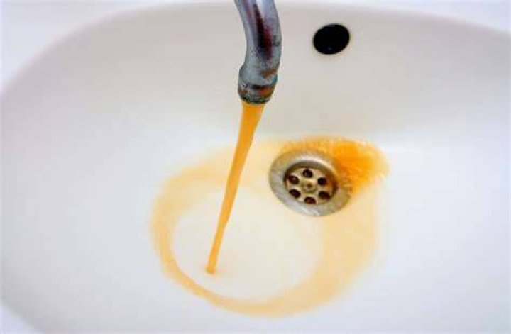Why is brown water coming out of hot water faucet?