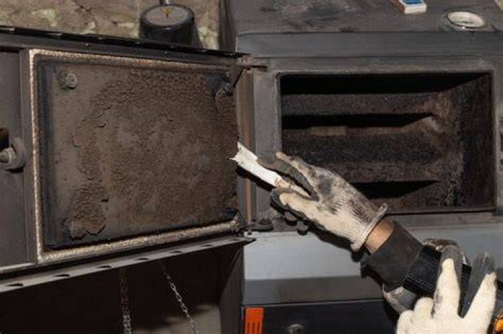 Why is my parents central heating boiler producing soot?