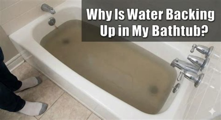 Why is my sink water backing up into my bathtub?