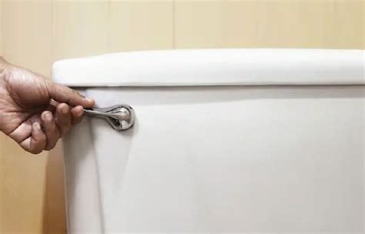 Why is my toilet lever hard to push down?