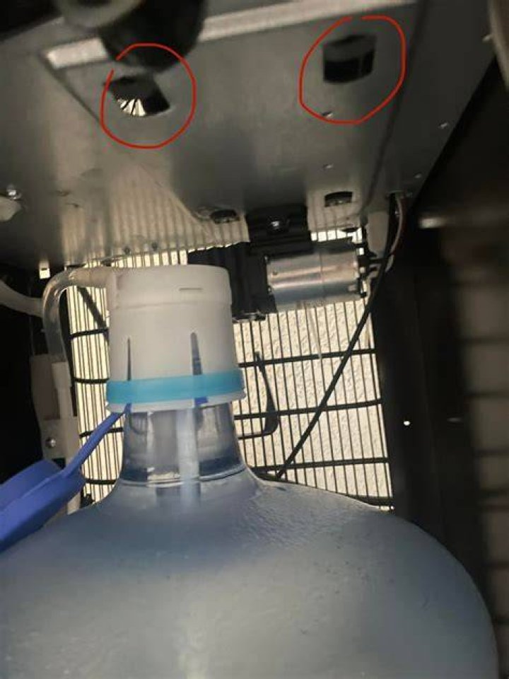 Why is my water dispenser leaking from the bottom?