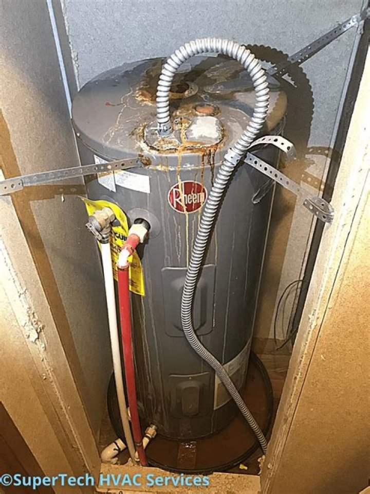 Why is the top of my water heater leaking?