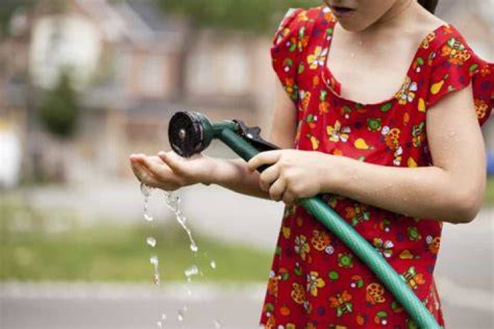 Why is the water coming out of my hose warm?