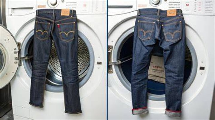 Why should jeans be turned inside out before washing?